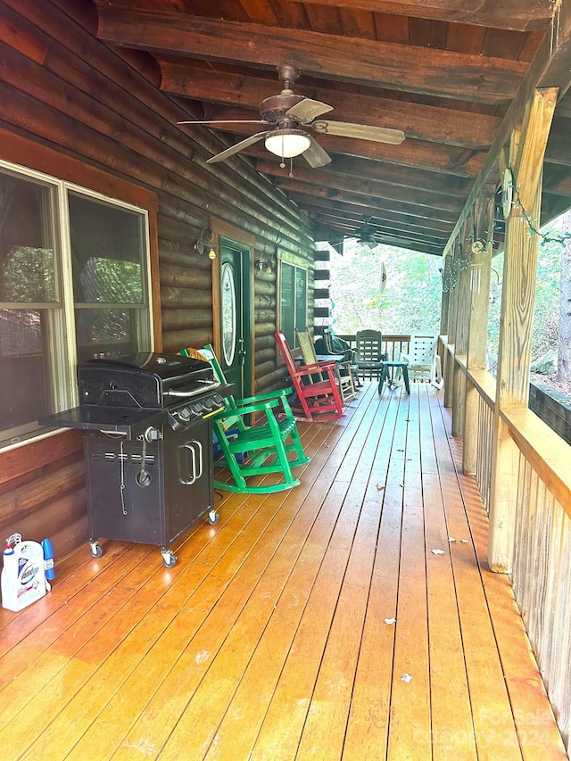 deck featuring ceiling fan and grilling area