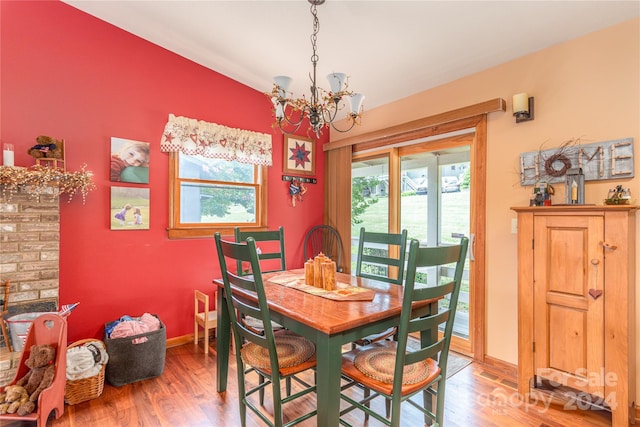 dining room featuring hardwood / wood-style flooring and a chandelier