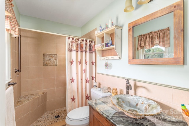 bathroom with vanity, toilet, walk in shower, and decorative backsplash