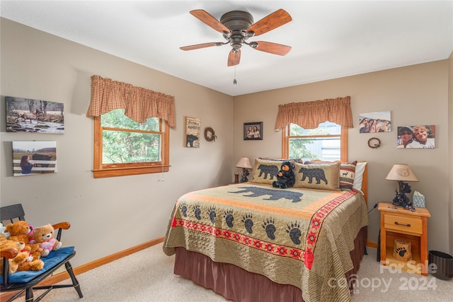 bedroom with ceiling fan and light colored carpet