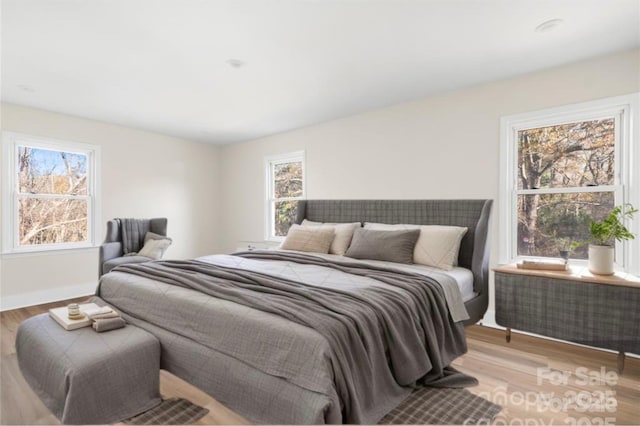 bedroom with light wood-type flooring