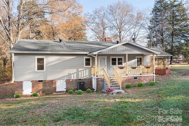 view of front of home with a front yard and a porch