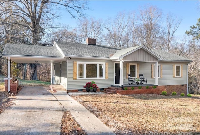 view of front of property featuring covered porch and a carport