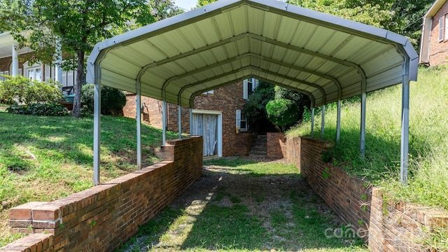 view of parking with a yard and a carport