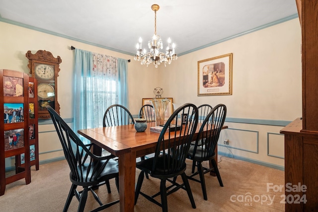 dining room with crown molding, an inviting chandelier, and light carpet