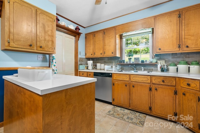 kitchen featuring backsplash, ornamental molding, sink, and stainless steel dishwasher