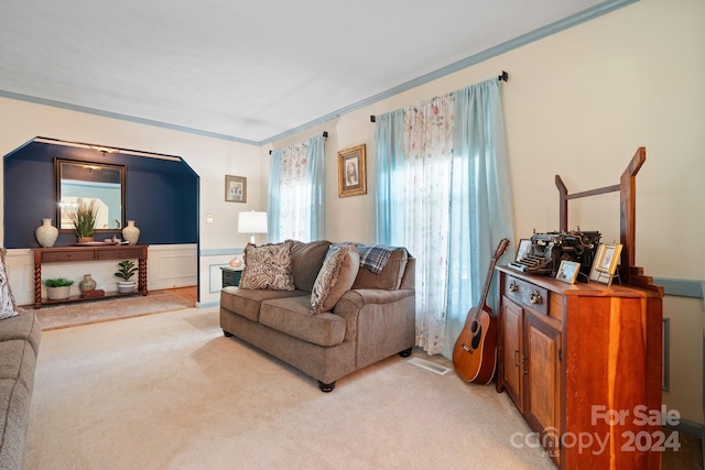 living room with a wealth of natural light and light colored carpet