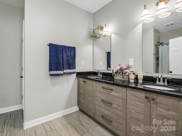 bathroom featuring vanity and wood-type flooring