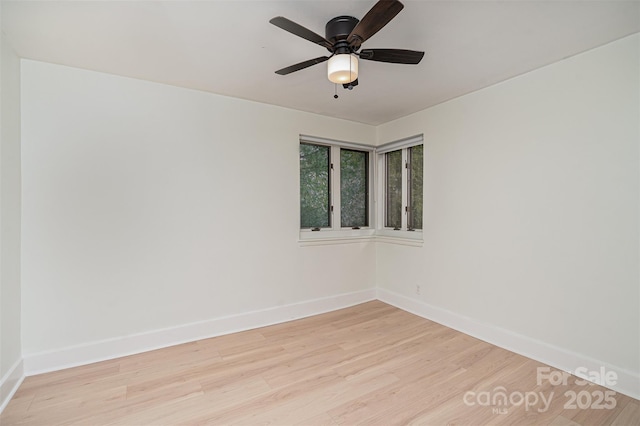 spare room featuring ceiling fan and light wood-type flooring