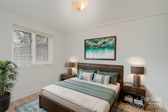 bedroom featuring hardwood / wood-style flooring