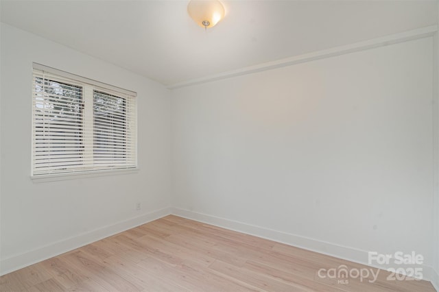 spare room featuring light hardwood / wood-style flooring