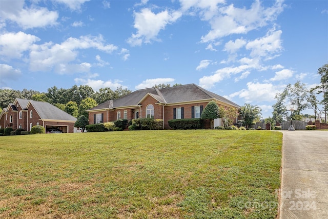 view of front of house with a front yard and brick siding