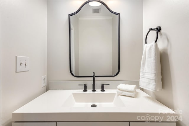 bathroom featuring visible vents and vanity