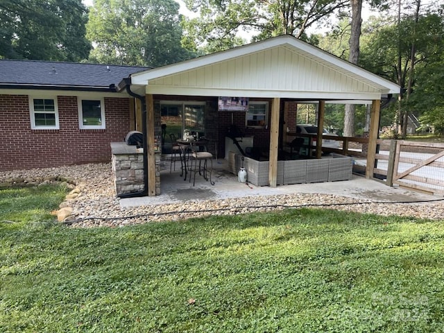 exterior space with a patio area, a yard, and outdoor lounge area