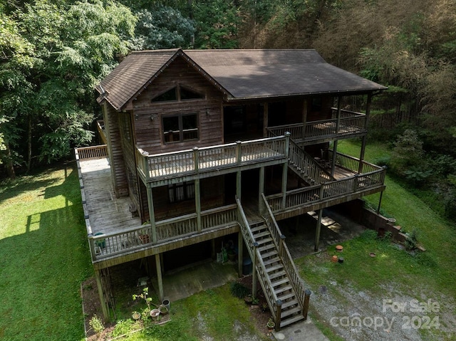 exterior space with a wooden deck and a yard