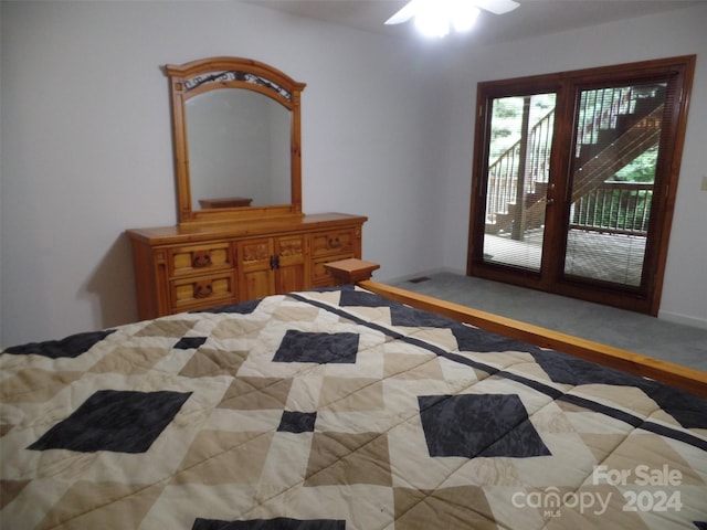 carpeted bedroom featuring ceiling fan and access to outside