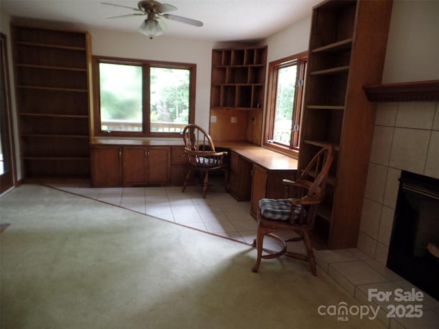 721 Kuenzel Eller Dr, Millers Creek, NC 28651 - office with ceiling fan, a fireplace, and light colored carpet