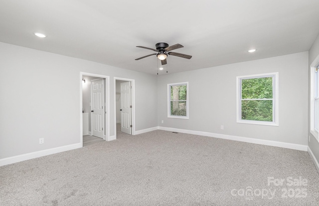 empty room with light carpet and ceiling fan