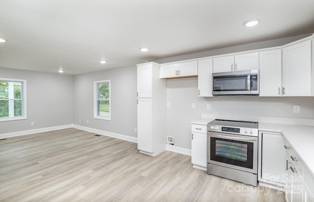 kitchen featuring white cabinetry and stainless steel appliances