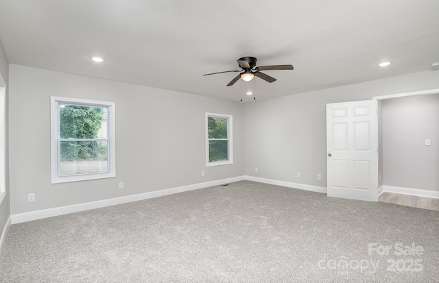 carpeted empty room featuring ceiling fan