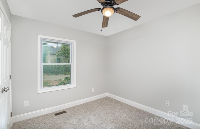 carpeted empty room with ceiling fan