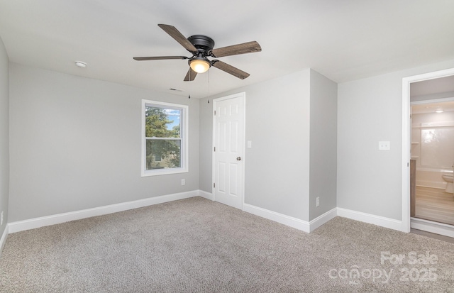 unfurnished bedroom featuring ceiling fan and carpet flooring