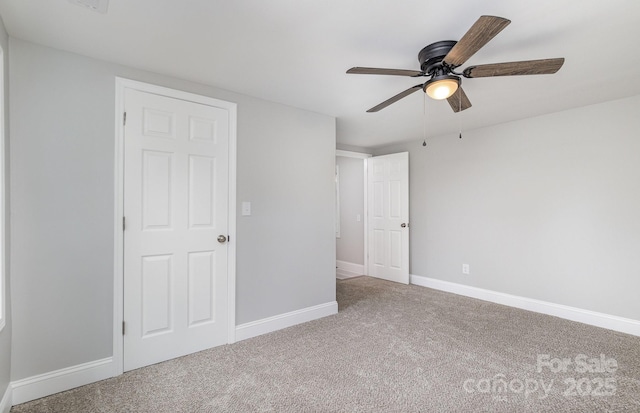 unfurnished bedroom with carpet and ceiling fan