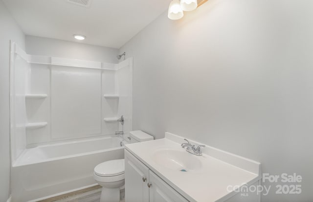 full bathroom featuring vanity, wood-type flooring, toilet, and shower / bath combination