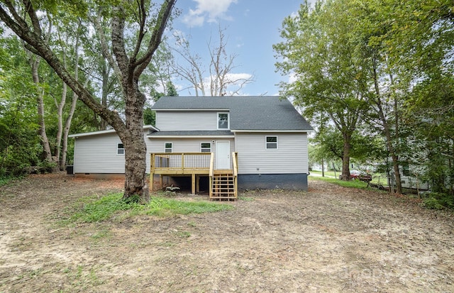 rear view of property with a deck