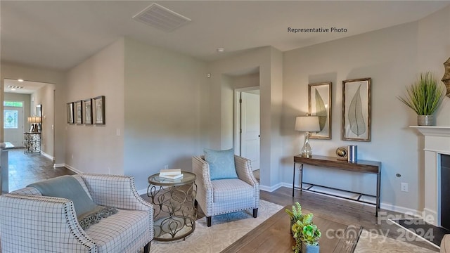 sitting room featuring hardwood / wood-style flooring