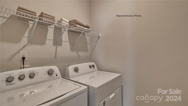 clothes washing area with washer and dryer