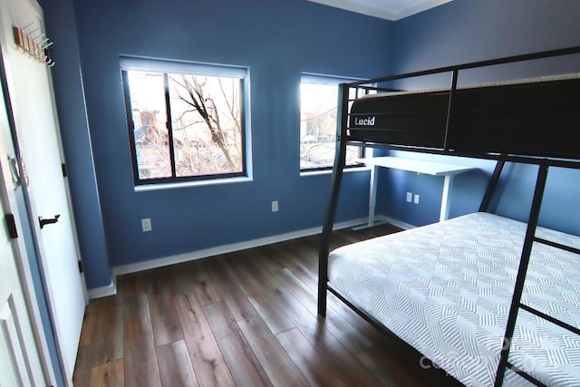 unfurnished bedroom featuring hardwood / wood-style flooring