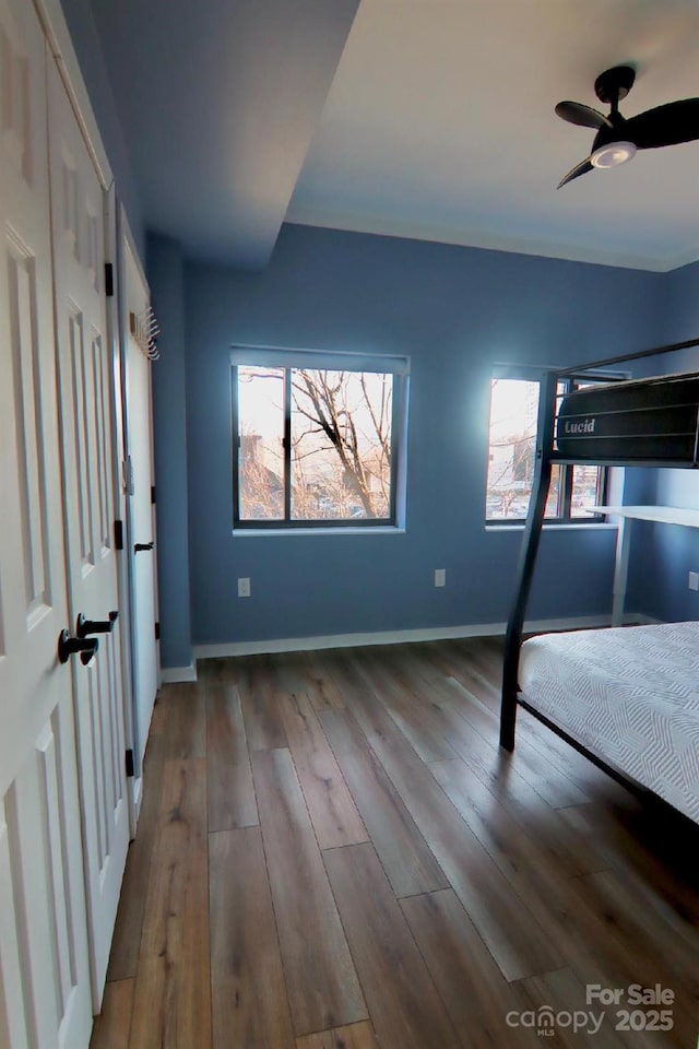 unfurnished bedroom with hardwood / wood-style floors