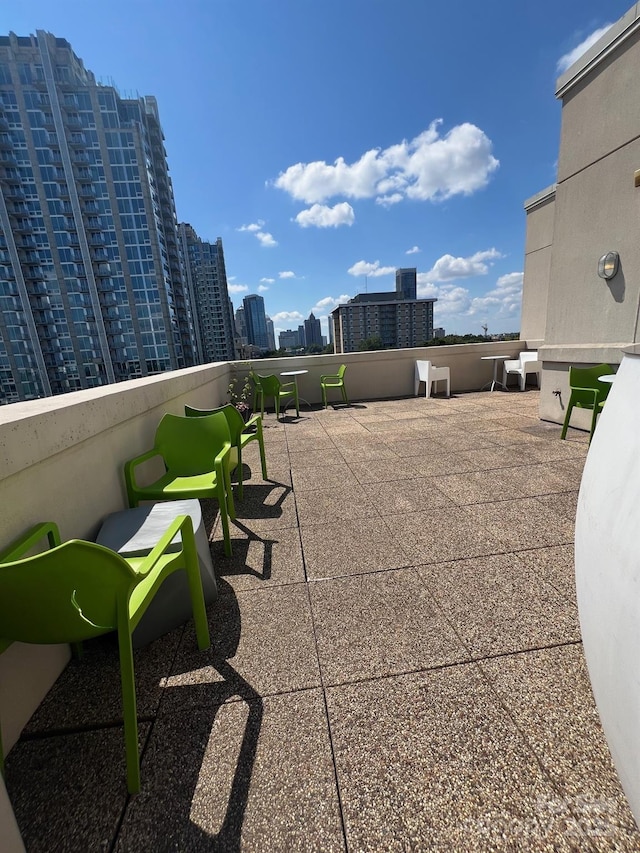 view of patio / terrace with a balcony