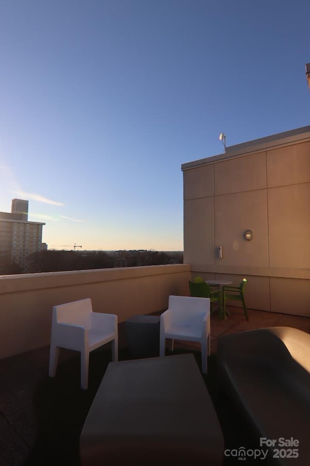 view of patio terrace at dusk