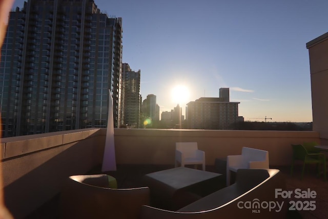 view of balcony at dusk