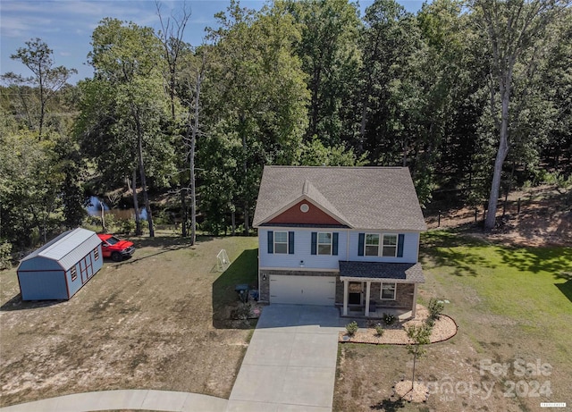 view of front facade featuring a front lawn and a garage