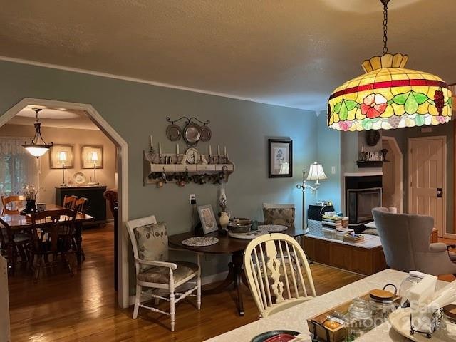 dining space with dark wood-type flooring