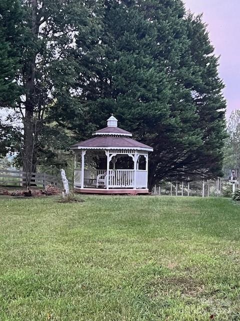 view of outbuilding featuring a lawn and a gazebo