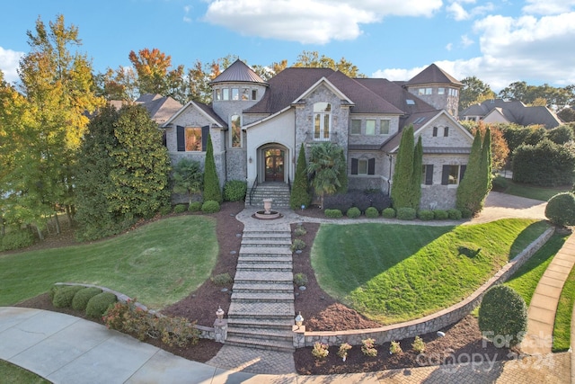 view of front of property with a front lawn