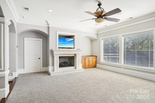 unfurnished living room featuring crown molding, carpet flooring, and ceiling fan