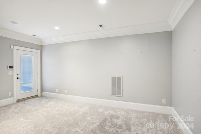 carpeted empty room featuring ornamental molding