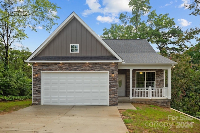 view of front of house with a garage and covered porch