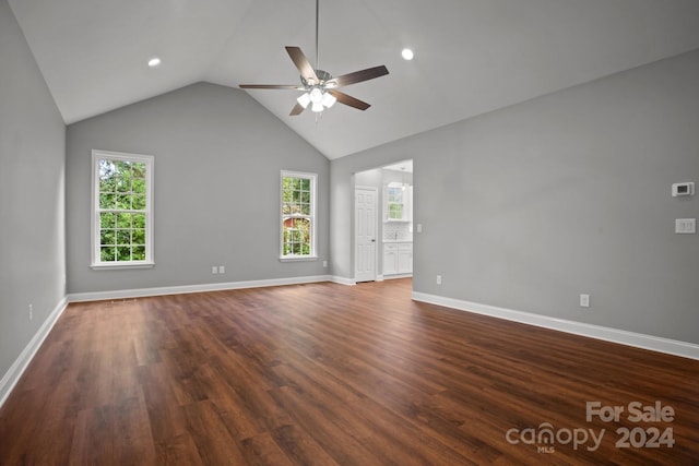 unfurnished room with dark wood-style flooring, lofted ceiling, recessed lighting, a ceiling fan, and baseboards