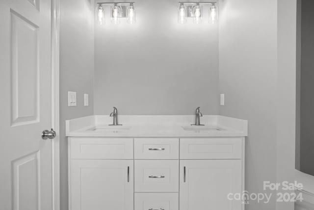 bathroom featuring double vanity and a sink