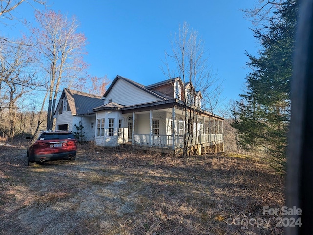 view of home's exterior featuring covered porch