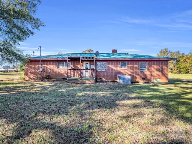 back of house with a yard