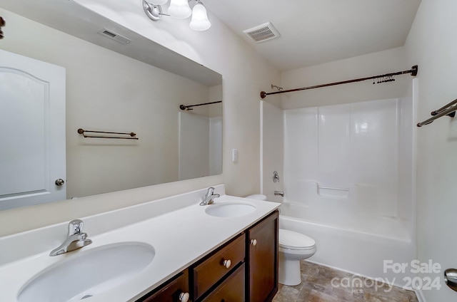 full bathroom with tub / shower combination, vanity, and toilet