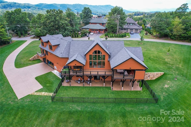 birds eye view of property featuring a mountain view