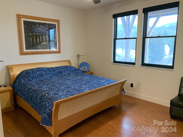 bedroom featuring hardwood / wood-style flooring and ceiling fan